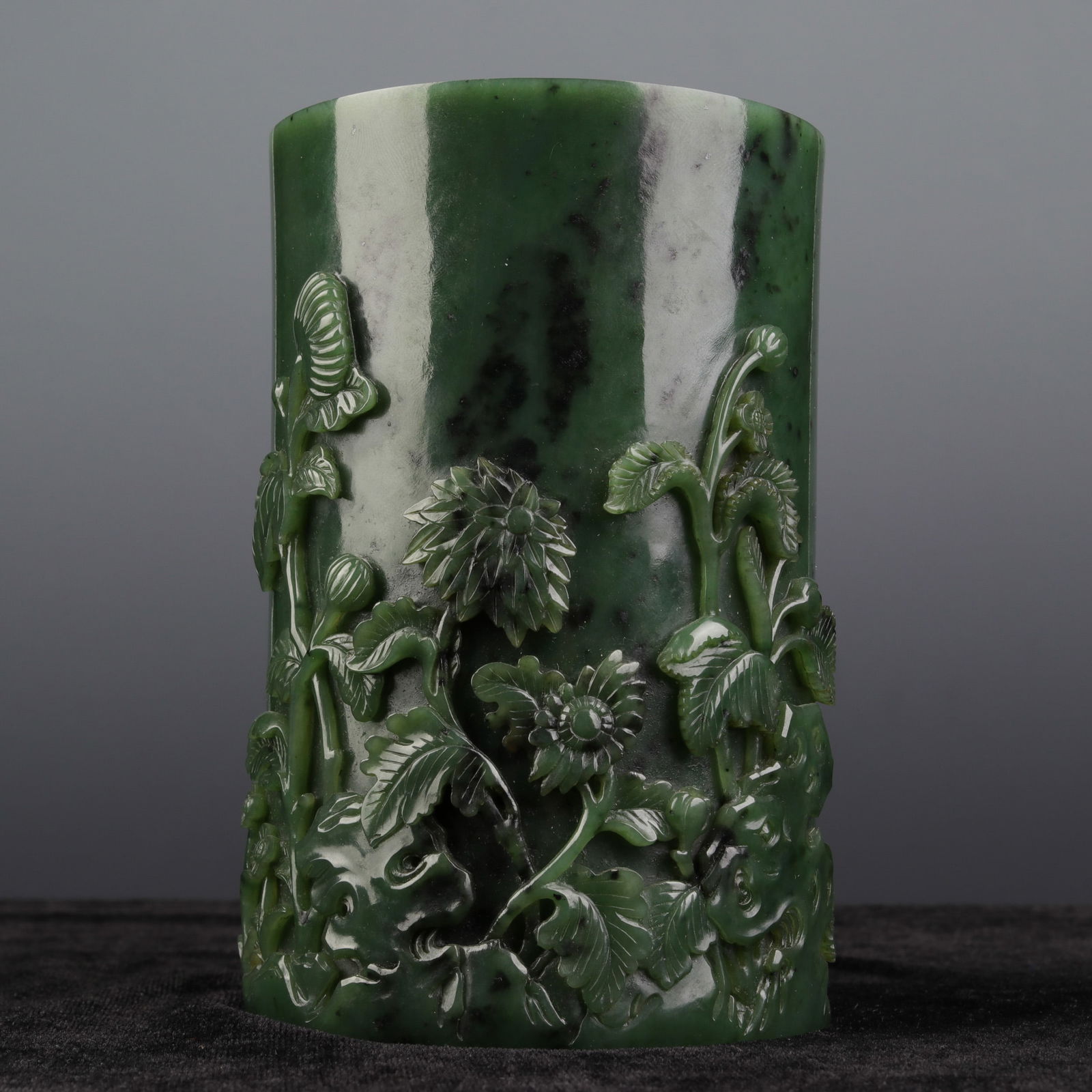 A CHINESE CARVED SPINACH GREEN JADE