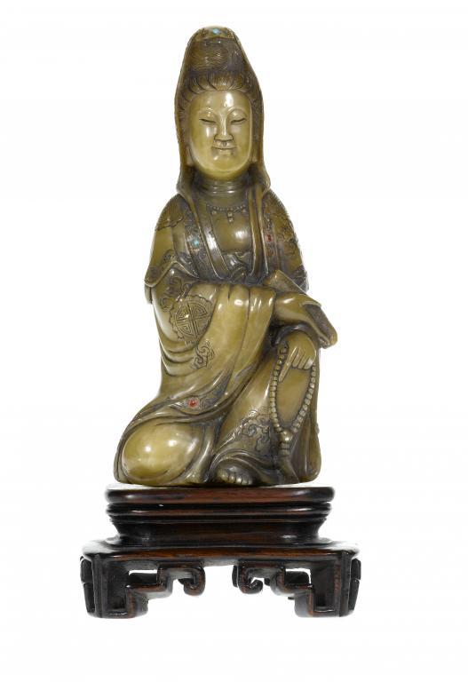 A CHINESE CARVED STONE FIGURE OF