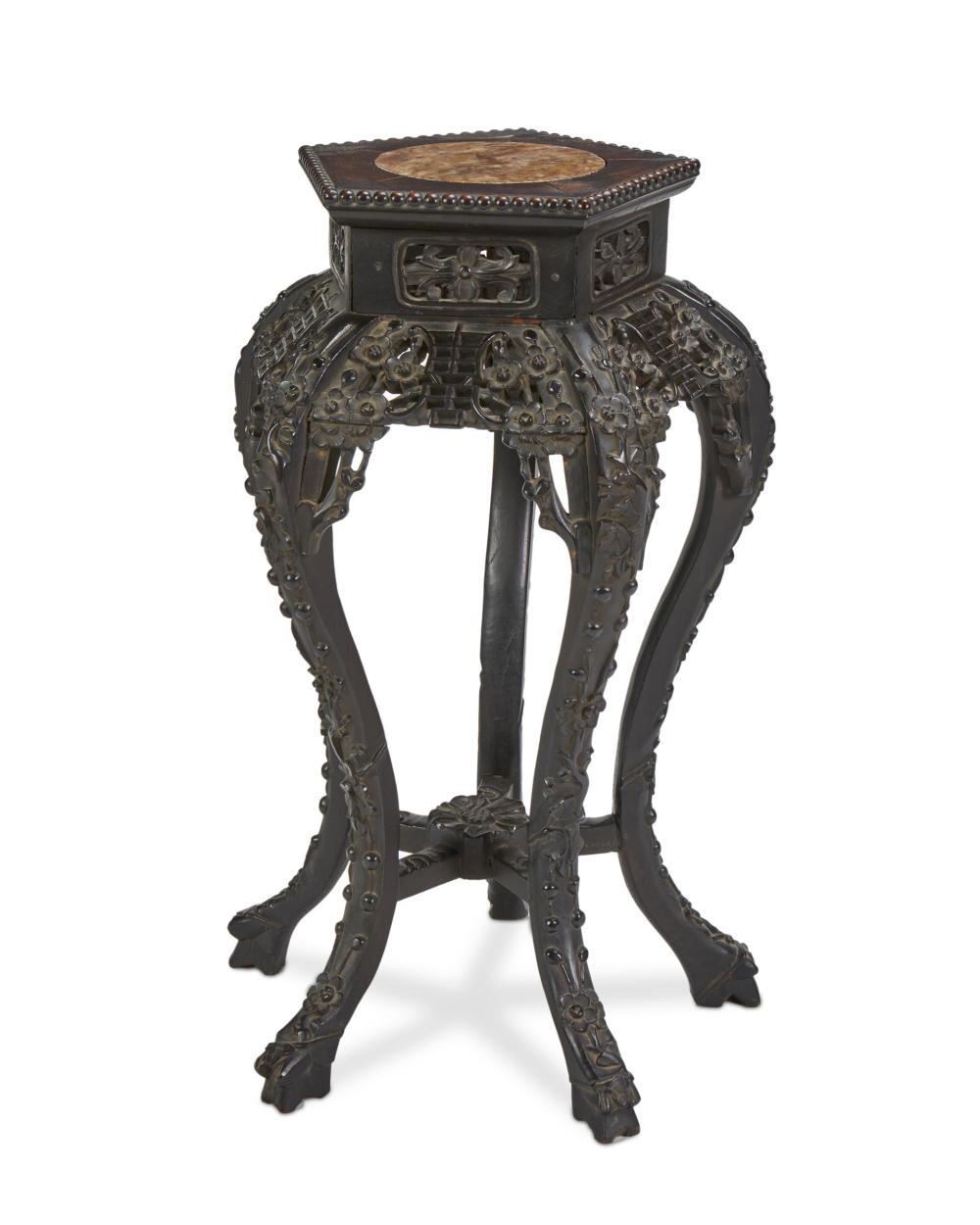 A CHINESE CARVED WOOD STANDA