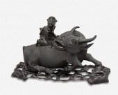 A CHINESE CARVED WOOD WATER BU