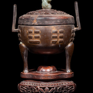 A Chinese Cast Bronze Tripod