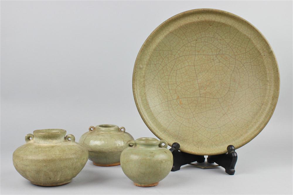 A CHINESE CELADON DISH WITH THREE