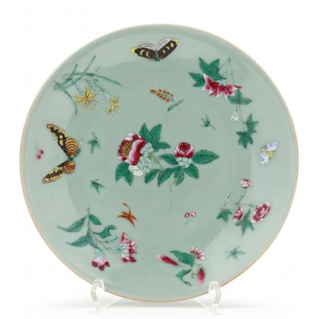 A CHINESE CELADON GROUND PLATE WITH