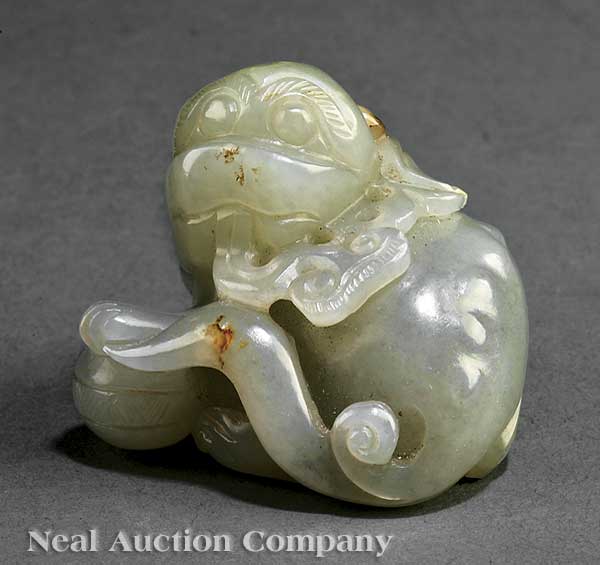A Chinese Celadon Jade Buddhist