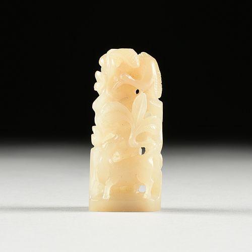 A CHINESE CELADON JADE FINIAL, DEER