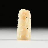A CHINESE CELADON JADE FINIAL,