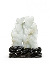 A Chinese celadon jade `Hehe E