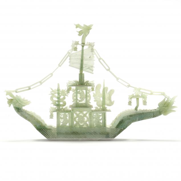 A CHINESE CELADON SERPENTINE DRAGON