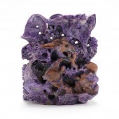 A CHINESE CHAROITE CARVING OF