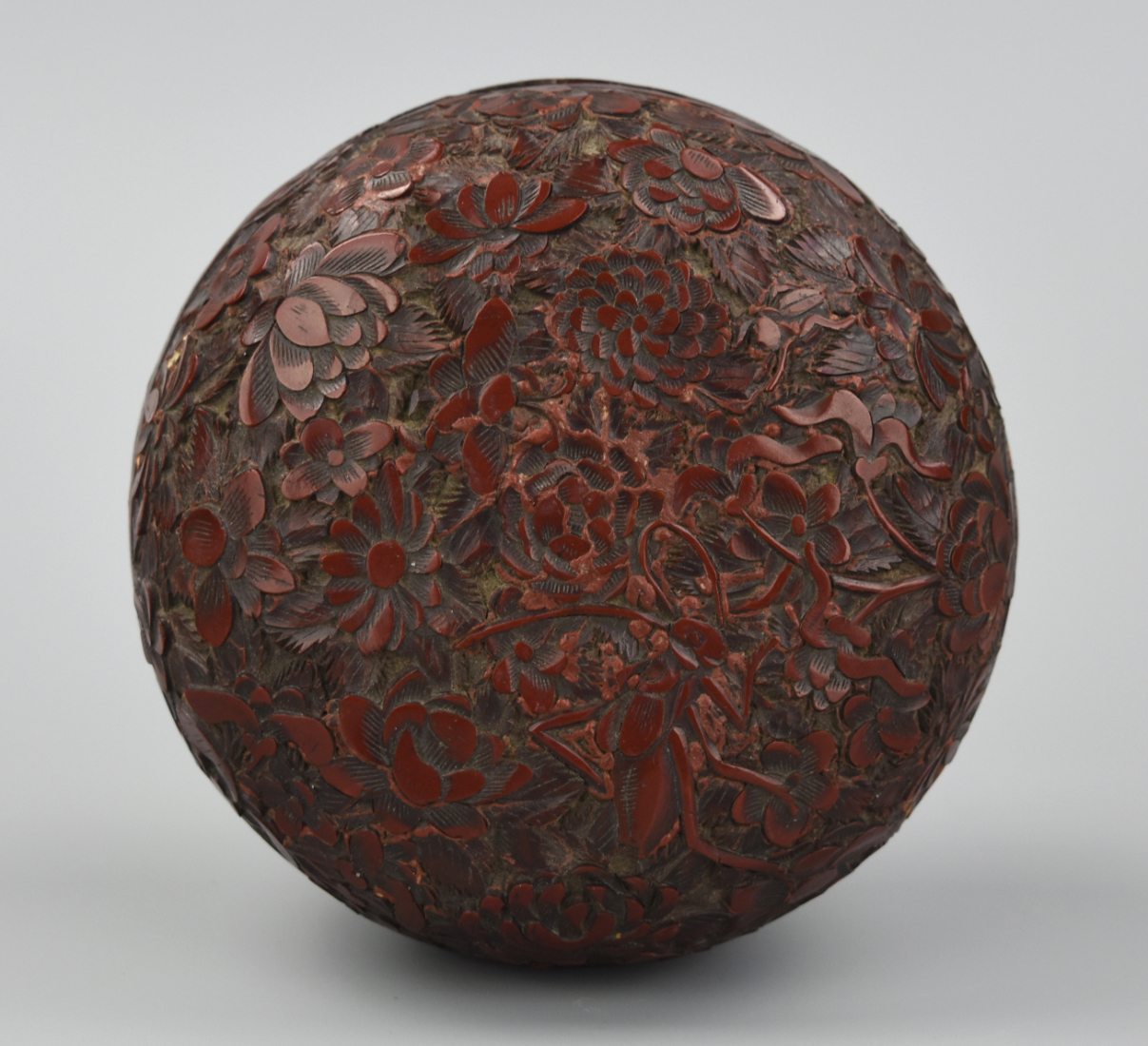 A CHINESE CIRCULAR CARVED LACQUER