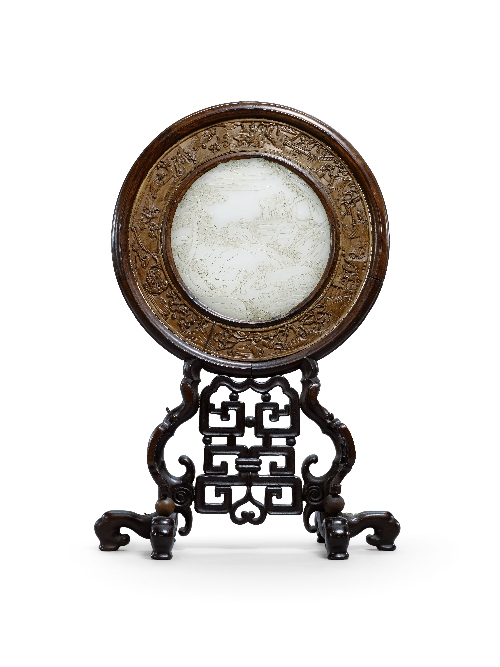 A Chinese circular celadon jade