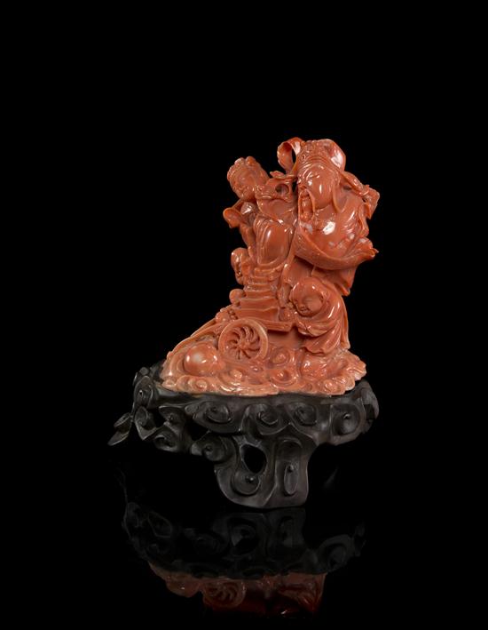 A Chinese Coral Carving depicting a