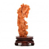 A CHINESE CORAL CARVING OF GUA