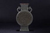 A CHINESE DUO-HANDLED PORCELAI