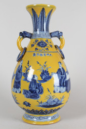 A CHINESE DUO-HANDLED YELLOW-C