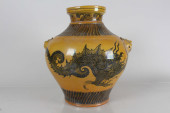 A CHINESE DUO-HANDLED YELLOW-C