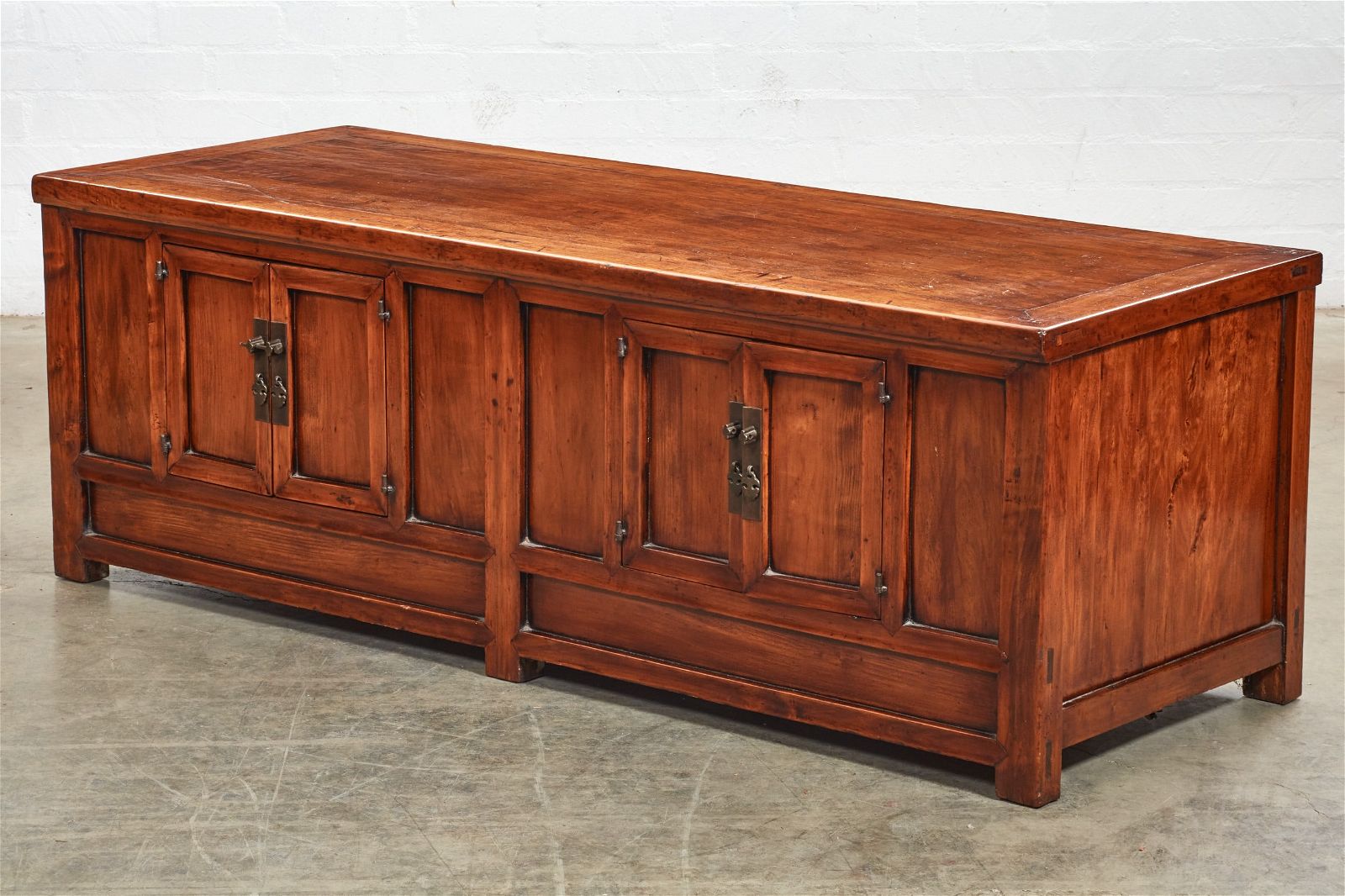 A CHINESE ELM LOW CUPBOARDA Chinese