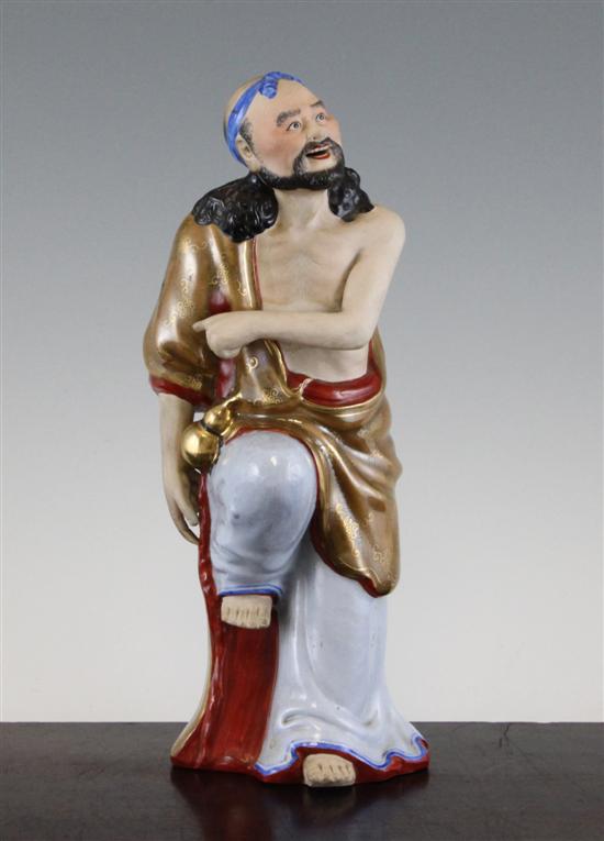 A Chinese enamelled and biscuit