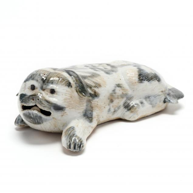 A CHINESE EXPORT STYLE RECUMBENT