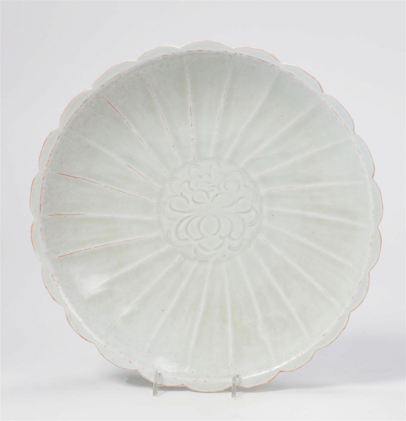 A CHINESE FLORIFORM DISH IN A