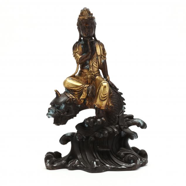 A CHINESE GILT BRONZE GUANYIN