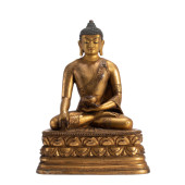 A CHINESE GILT BRONZE SHAKYAMU