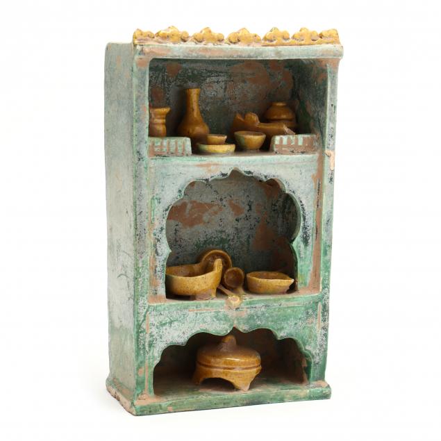 A CHINESE GLAZED POTTERY CUPBOARD