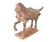 A CHINESE GLAZED POTTERY FIGUR