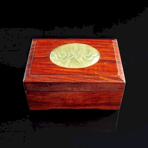 A CHINESE GREEN JADE MOUNTED