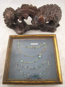A Chinese hardwood carving of a