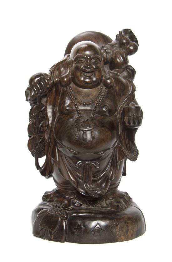 A Chinese Hardwood Carving of a