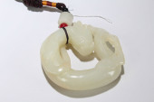 A CHINESE HOTAN-CURVING JADE F
