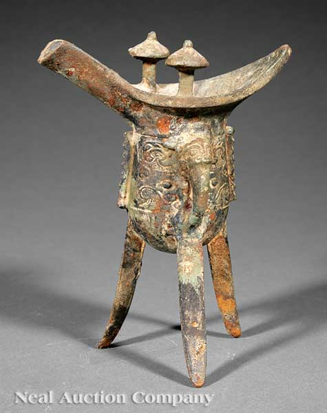 A Chinese Iron Tripod Ritual Wine