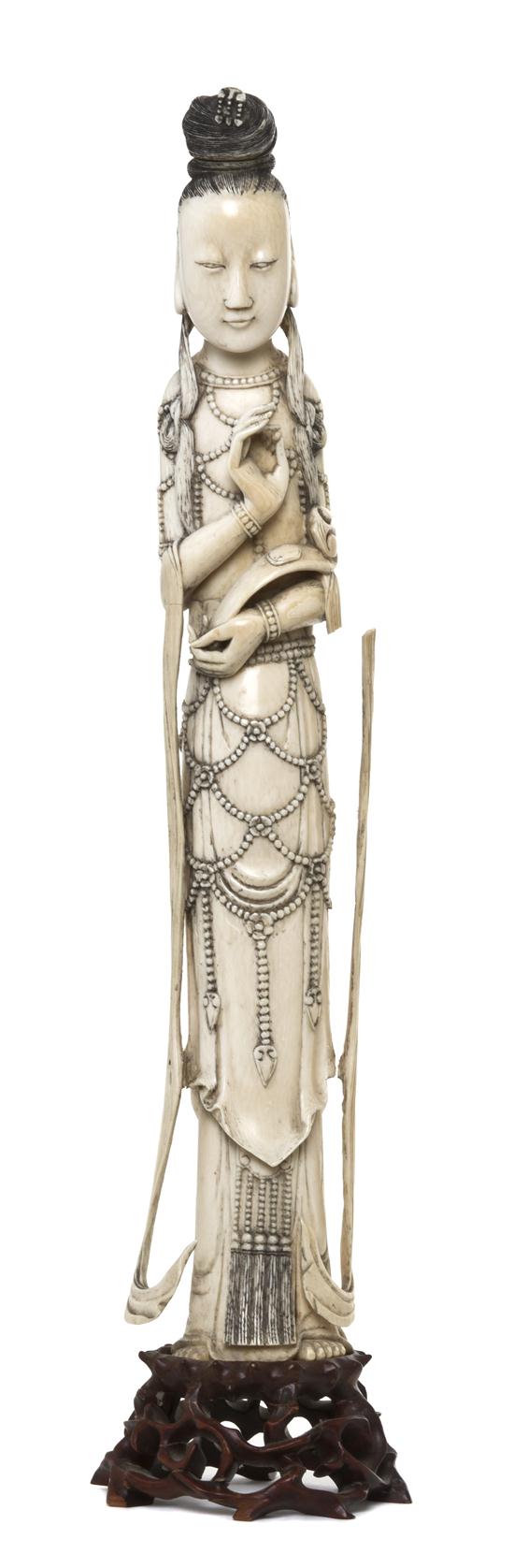 *A Chinese Ivory Figure of a