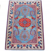 A CHINESE KHOTAN CARPET A Chin