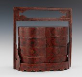 A Chinese Lacquered Stacking L