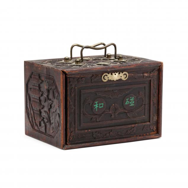 A CHINESE MAHJONG SET IN CARVED
