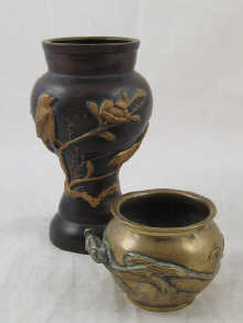 A Chinese metal bowl encircled by a