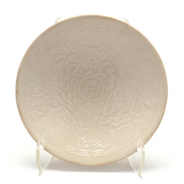 A CHINESE MOLDED BOWL WITH