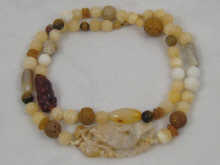 A Chinese necklace with carved jade
