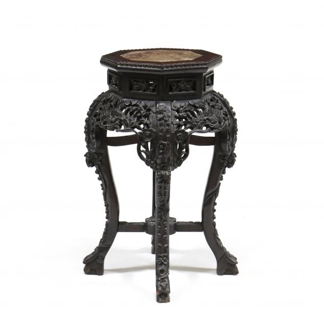 A CHINESE OCTAGONAL CARVED