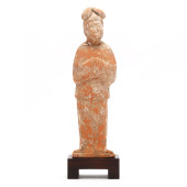 A CHINESE PAINTED POTTERY FIGU