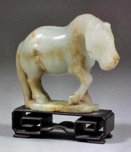 A Chinese pale celadon jade carving