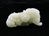 A Chinese pale celadon jade ca