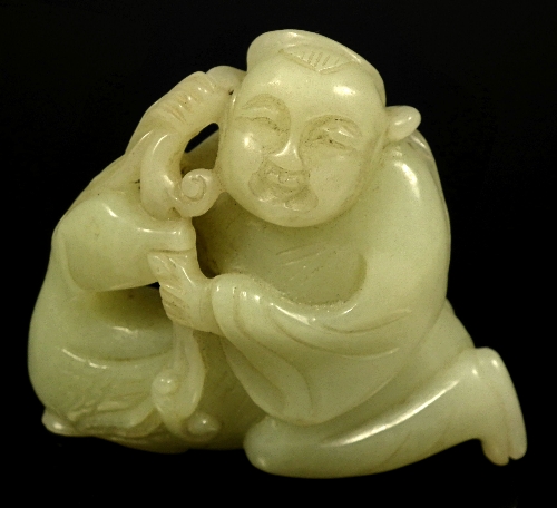 A Chinese pale green carved jade