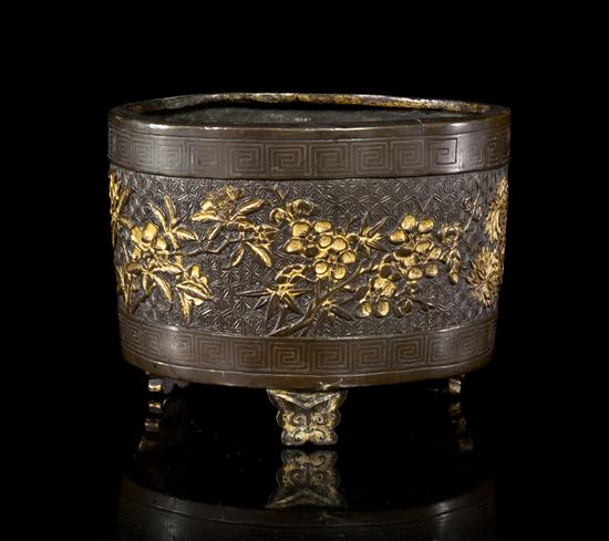 A Chinese Parcel-Gilt Bronze Tripod