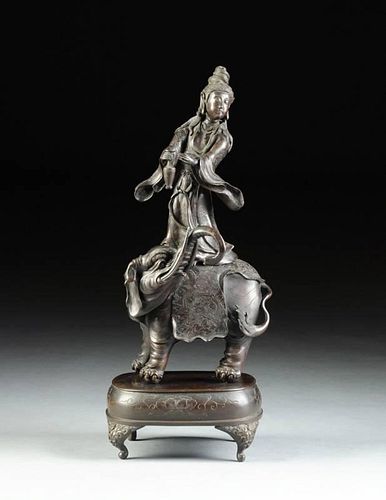 A CHINESE PATINATED BRONZE