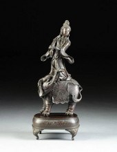 A CHINESE PATINATED BRONZE FIG