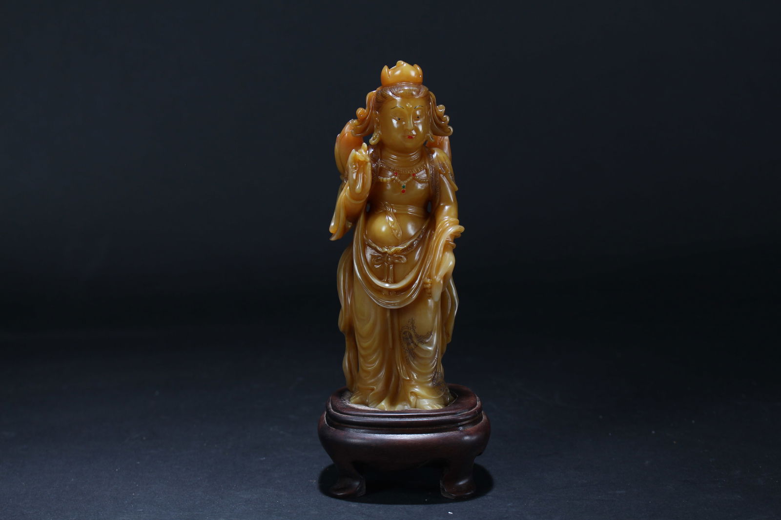 A CHINESE PEACEFUL-POSING SOAPSTONE