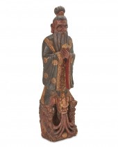 A CHINESE POLYCHROMED WOOD SCU